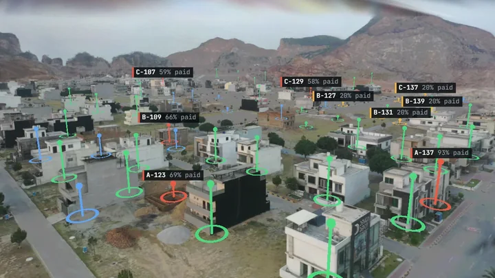 A housing society in Pakistan rebuilt in 3D, every plot coloured by payment status
